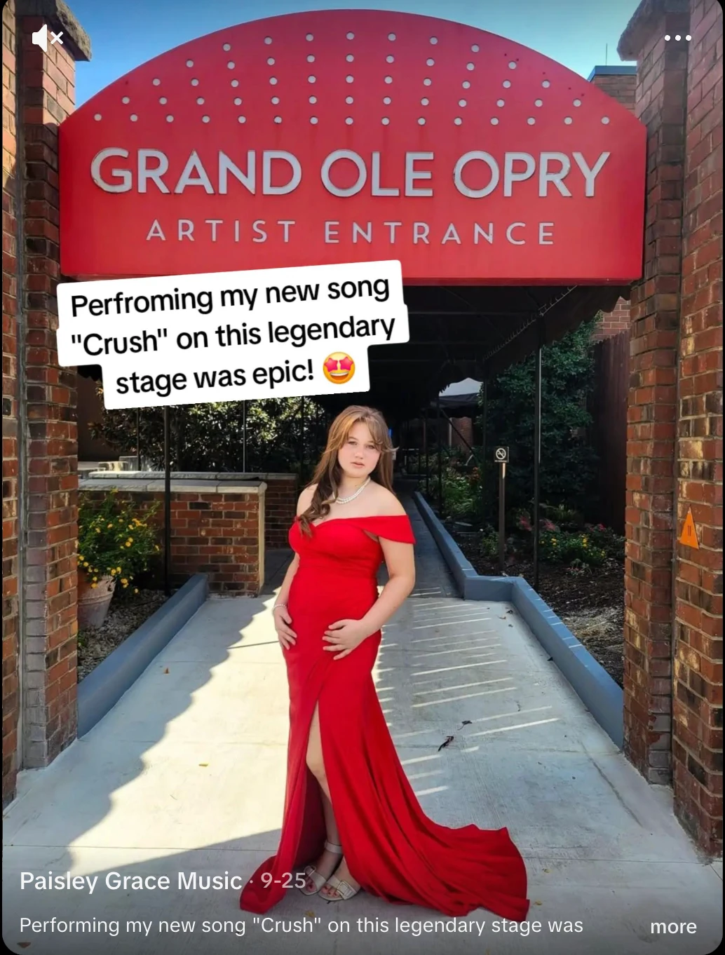 Paisley Grace in a red gown beneath the 'Grand Ole Opry Artist Entrance' sign in Nashville, after performing her new song 'Crush' at the 2026 Josie Music Awards